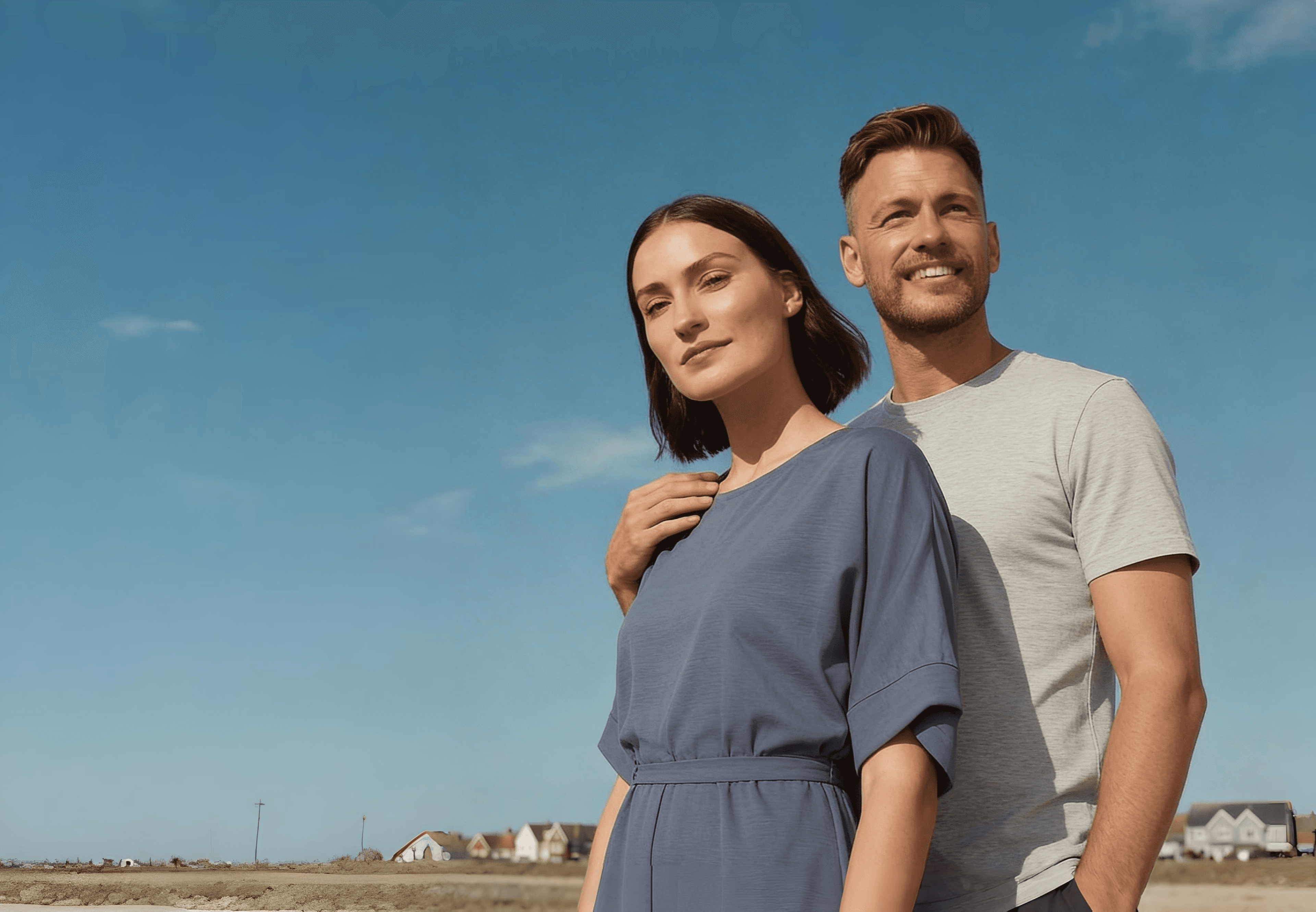Couple in front of their home — Glonari residential hero